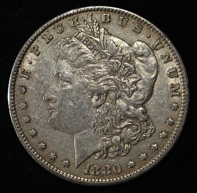 1880-O MORGAN DOLLAR XF/AU. LEADERS IN ON-LINE AUCTIONS ESTIMATE $100 - $130.