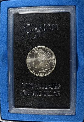1884-CC MORGAN DOLLAR GSA. BID WITH SILVER CITY AUCTIONS ESTIMATE $500 - $600.