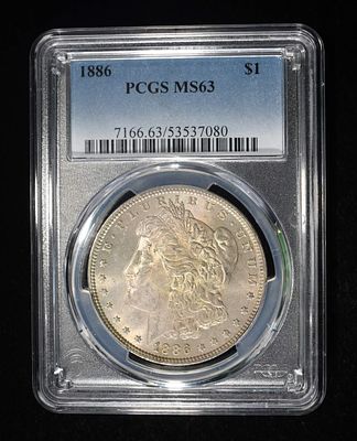 1886 MORGAN DOLLAR PCGS MS-63. LEADERS IN ON-LINE AUCTIONS ESTIMATE $130 - $150.