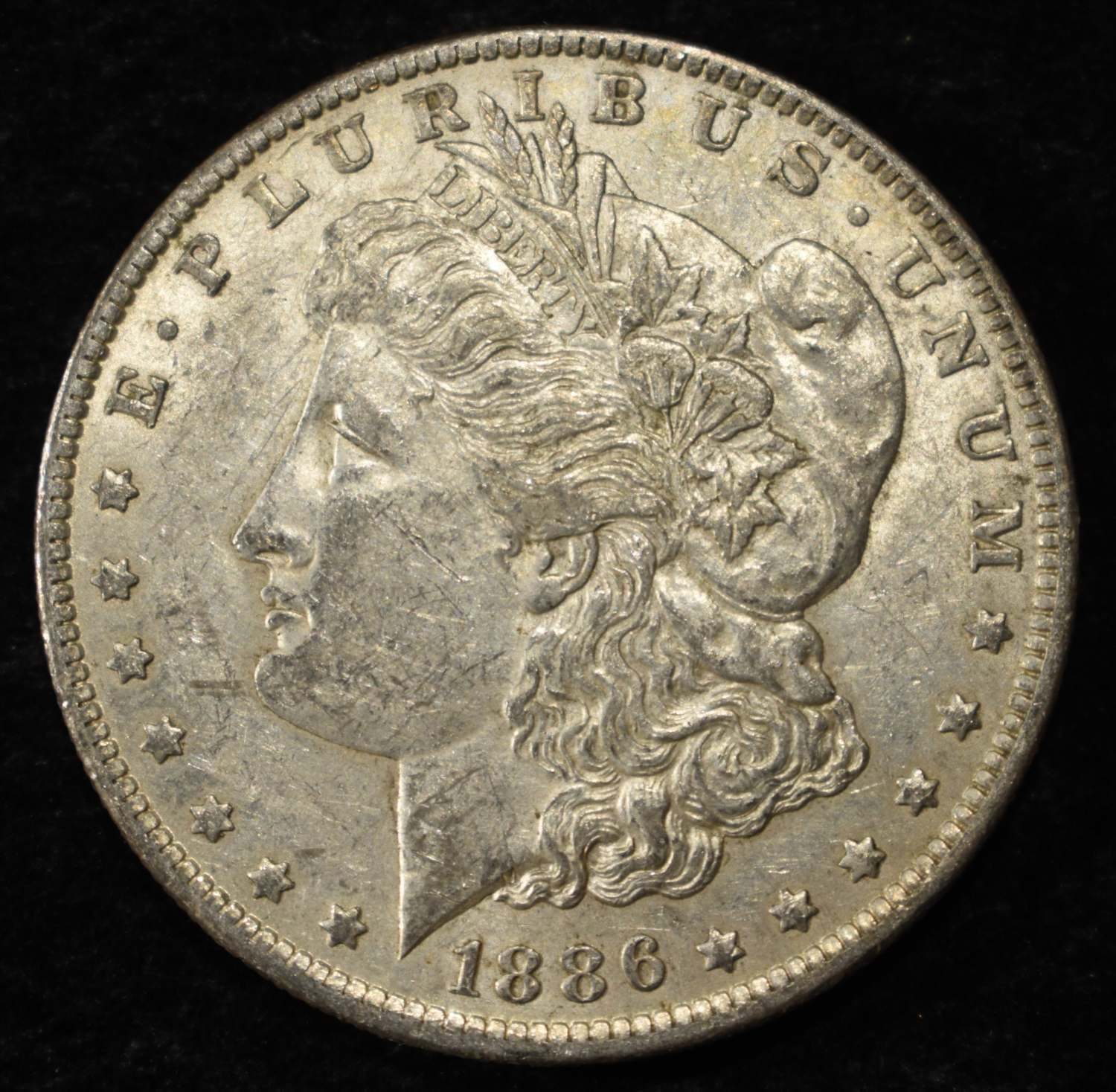 1886-O MORGAN DOLLAR AU