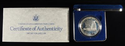 1987-S $1 COMMEM US CONSTITUTION. BID WITH SILVER CITY AUCTIONS ESTIMATE $100 - $150.