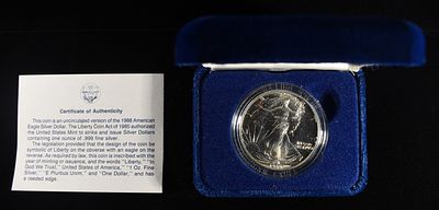 1988 AMERICAN SILVER EAGLE. CHECK OUT OUR UPCOMING AUCTIONS ESTIMATE $110 - $160.
