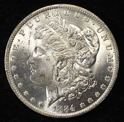 1884-O MORGAN DOLLAR BU. LEADERS IN ON-LINE AUCTIONS ESTIMATE $130 - $150.