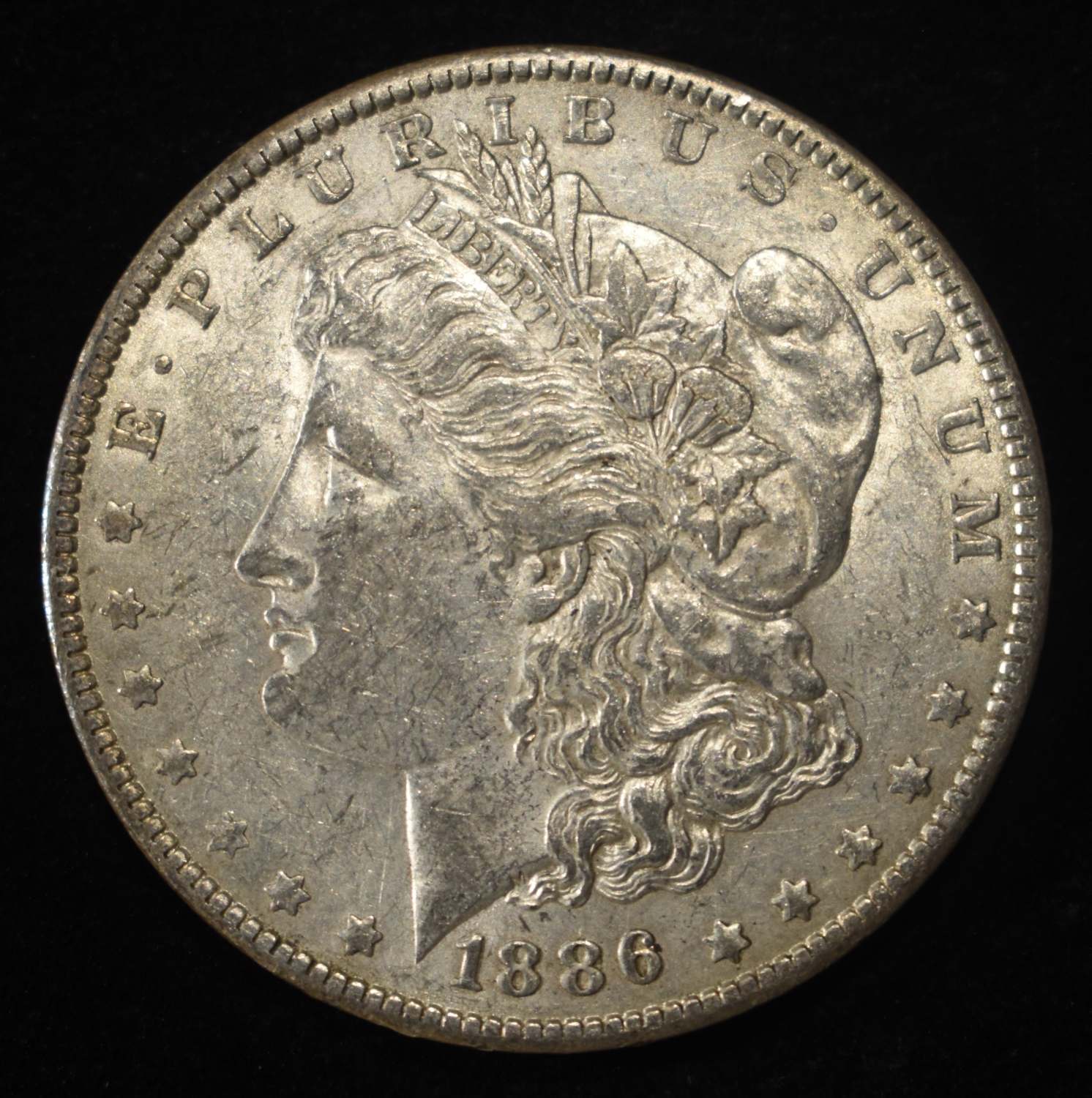1886-O MORGAN DOLLAR AU