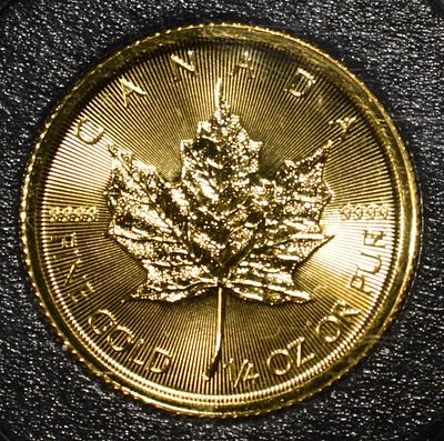 2023 MAPLE LEAF 1/4TH OZ .9999 GOLD. WEEKLY COIN & CURRENCY AUCTIONS ESTIMATE $1500 - $1600.