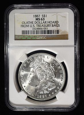 1887 MORGAN DOLLAR NGC MS-63 OLATHE HOARD. CHECK OUT OUR UPCOMING AUCTIONS ESTIMATE $130 - $150.