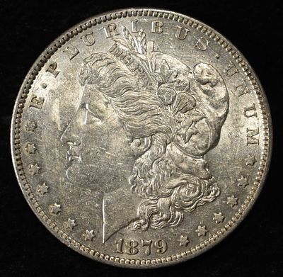 1879-O MORGAN DOLLAR AU/BU. BID WITH SILVER CITY AUCTIONS ESTIMATE $130 - $150.