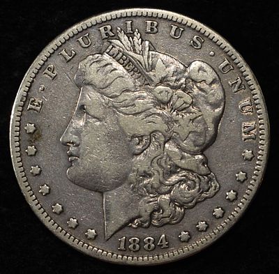 1884-S MORGAN DOLLAR VF - SCRATCHES. CHECK OUT OUR UPCOMING AUCTIONS ESTIMATE $60 - $80.