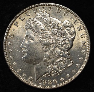 1886 MORGAN DOLLAR. WEEKLY COIN & CURRENCY AUCTIONS ESTIMATE $75 - $100.