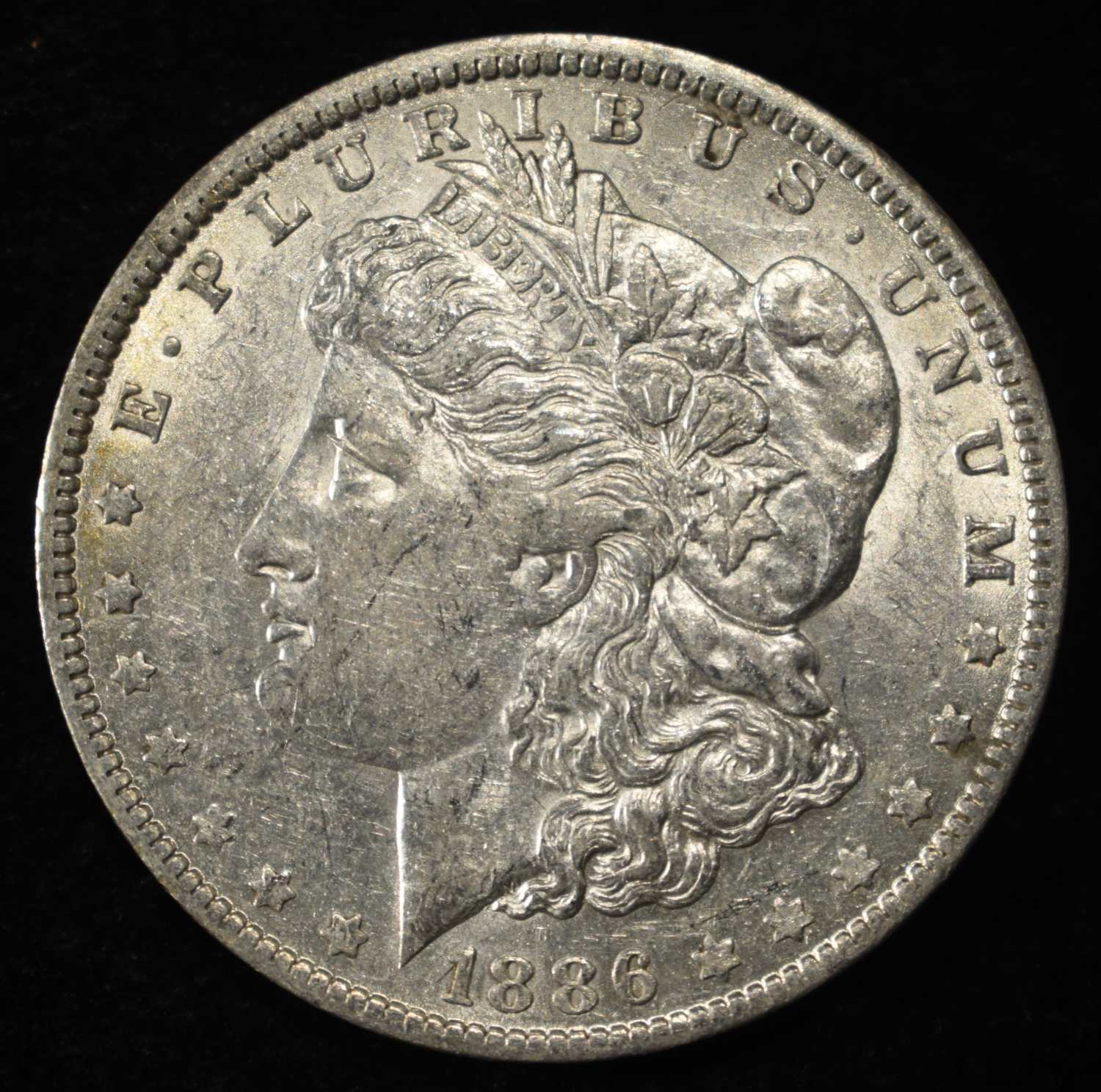 1886-O MORGAN DOLLAR AU