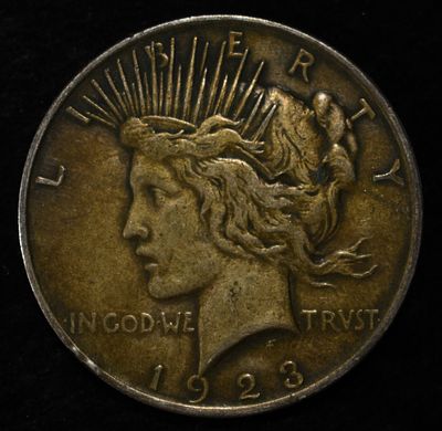 1923 PEACE DOLLAR. BID WITH SILVER CITY AUCTIONS ESTIMATE $90 - $130.