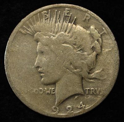 1924-S PEACE DOLLAR. CHECK OUT OUR UPCOMING AUCTIONS ESTIMATE $90 - $130.