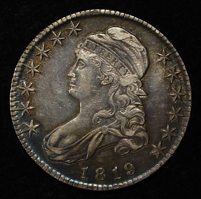 1819 BUST HALF DOLLAR AU. CHECK OUT OUR UPCOMING AUCTIONS ESTIMATE $800 - $900.