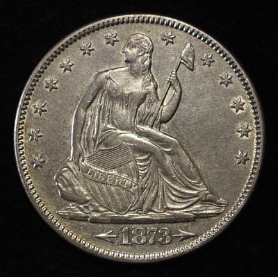 1873 SEATED LIBERTY HALF DOLLAR AU/BU. BID WITH SILVER CITY AUCTIONS ESTIMATE $900 - $1000.