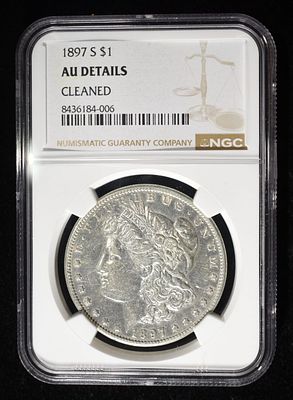 1897-S MORGAN DOLLAR NGC AU DETAILS CLEANED. CHECK OUT OUR UPCOMING AUCTIONS ESTIMATE $90 - $130.