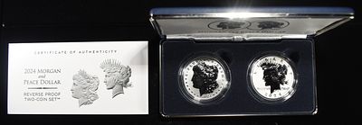 2024-S MORGAN & PEACE DOLLAR REV PR TWO-COIN SET. LEADERS IN ON-LINE AUCTIONS ESTIMATE $240 - $290.