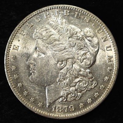 1879-O MORGAN DOLLAR AU/BU. LEADERS IN ON-LINE AUCTIONS ESTIMATE $130 - $150.