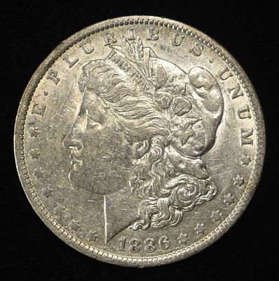 1886-O MORGAN DOLLAR AU. WEEKLY COIN & CURRENCY AUCTIONS ESTIMATE $170 - $200.