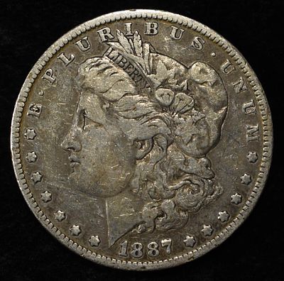 1887-O MORGAN DOLLAR. BID WITH SILVER CITY AUCTIONS ESTIMATE $75 - $100.