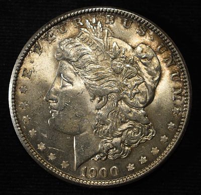 1900 MORGAN DOLLAR BU. CHECK OUT OUR UPCOMING AUCTIONS ESTIMATE $100 - $130.