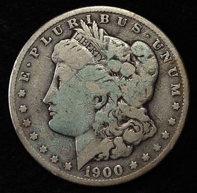 1900-O MORGAN DOLLAR. BID WITH SILVER CITY AUCTIONS ESTIMATE $90 - $130.