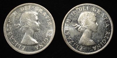 (2) 80% SILVER CANADIAN DOLLARS. CHECK OUT OUR UPCOMING AUCTIONS ESTIMATE $130 - $180.