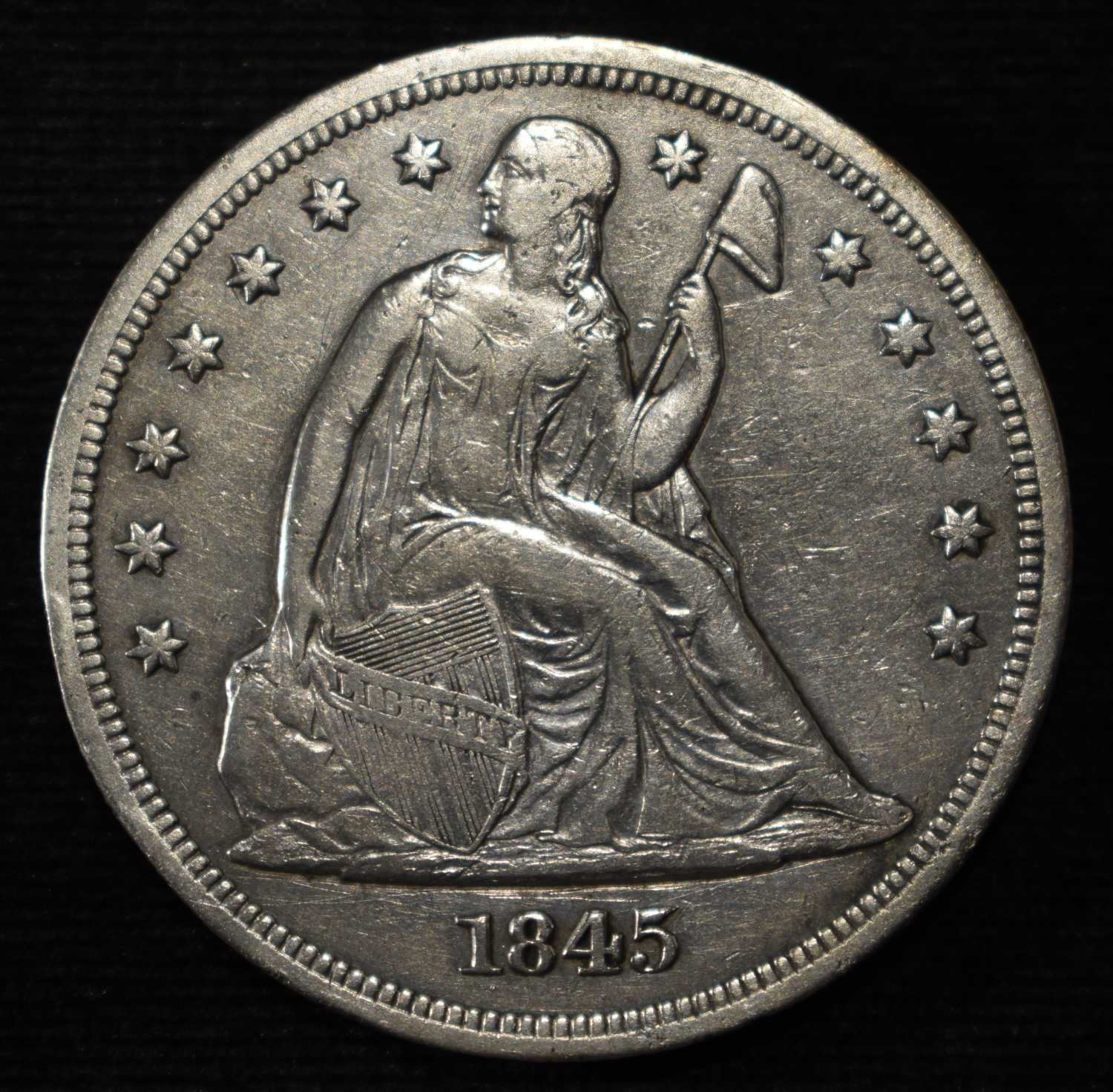 1845 LIBERTY SEATED DOLLAR AU