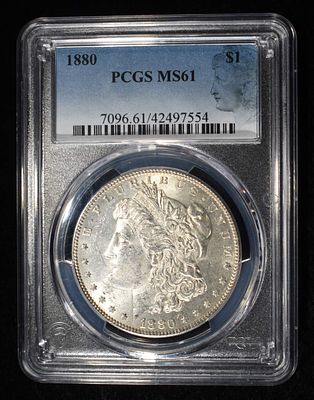 1880 MORGAN DOLLAR PCGS MS-61. CHECK OUT OUR UPCOMING AUCTIONS ESTIMATE $100 - $130.