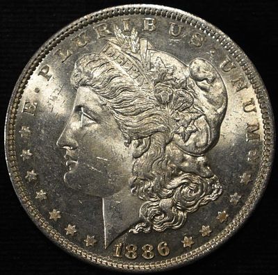1886 MORGAN DOLLAR NICE BU PL. BID WITH SILVER CITY AUCTIONS ESTIMATE $130 - $180.