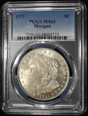 1921 MORGAN DOLLAR PCGS MS-63. CHECK OUT OUR UPCOMING AUCTIONS ESTIMATE $130 - $150.