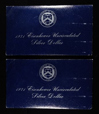 (2) 1971 EISENHOWER UNC SILVER DOLLARS. WEEKLY COIN & CURRENCY AUCTIONS ESTIMATE $60 - $80.