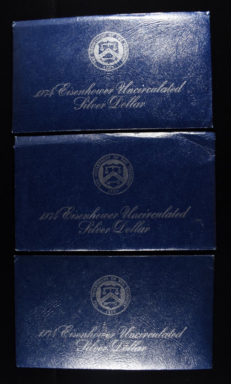 (3) 1974 EISENHOWER DOLLAR BLUE PACKAGING