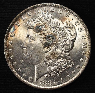 1884-O MORGAN DOLLAR BU. WEEKLY COIN & CURRENCY AUCTIONS ESTIMATE $150 - $200.