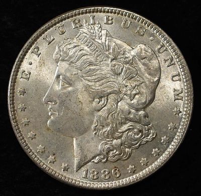 1886 MORGAN DOLLAR. TOP RATED AUCTION HOUSE ESTIMATE $90 - $130.