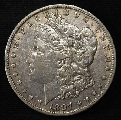 1897-O MORGAN DOLLAR AU. WEEKLY COIN & CURRENCY AUCTIONS ESTIMATE $150 - $200.
