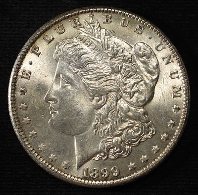 1899-O MORGAN DOLLAR BU. LEADERS IN ON-LINE AUCTIONS ESTIMATE $100 - $130.