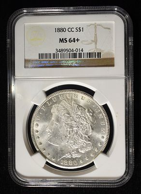 1880-CC MORGAN DOLLAR NGC MS-64+. BID WITH SILVER CITY AUCTIONS ESTIMATE $1000 - $1200.