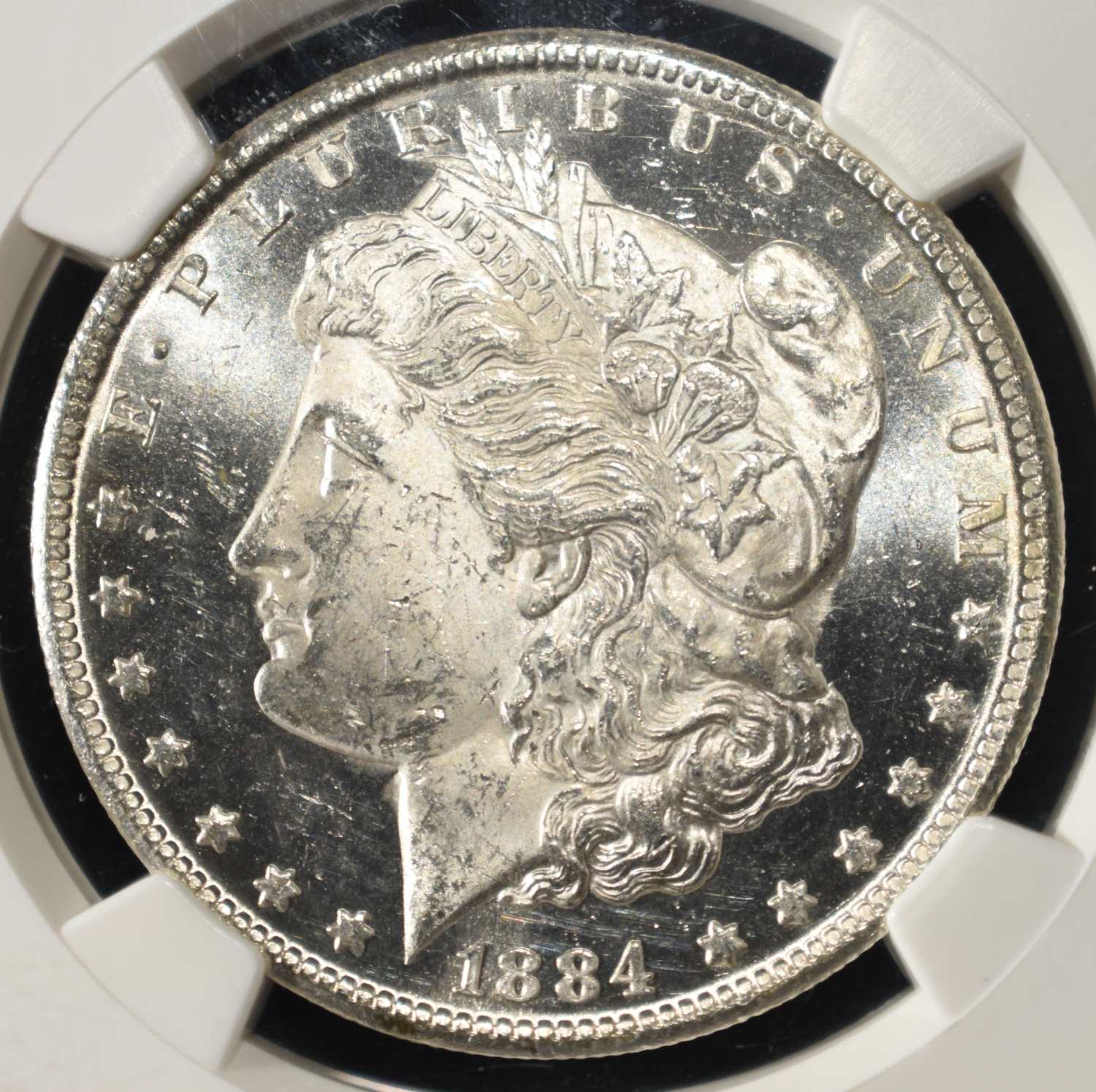 1884-CC MORGAN DOLLAR NGC MS-62 DPL