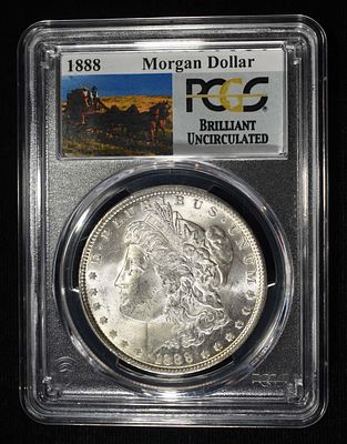 1888 MORGAN DOLLAR PCGS BU. CHECK OUT OUR UPCOMING AUCTIONS ESTIMATE $100 - $130.