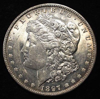 1897-O MORGAN DOLLAR BU. TOP RATED AUCTION HOUSE ESTIMATE $1200 - $1400.
