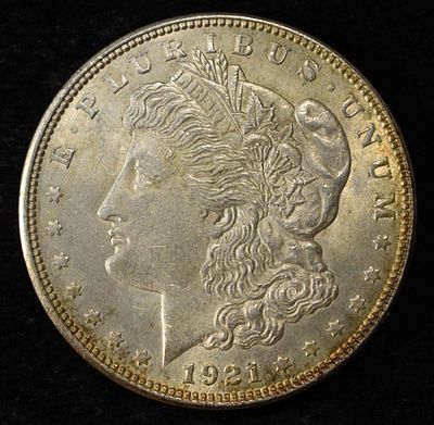 1921 MORGAN DOLLAR. BID WITH SILVER CITY AUCTIONS ESTIMATE $90 - $130.