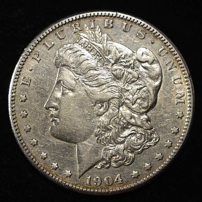 1904-S MORGAN DOLLAR AU/BU. CHECK OUT OUR UPCOMING AUCTIONS ESTIMATE $3500 - $4000.