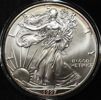 1997 AMERICAN SILVER EAGLE. WEEKLY COIN & CURRENCY AUCTIONS ESTIMATE $90 - $130.