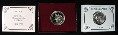 1982-S PROOF & 82-D UNC 50C COMMEMS. CHECK OUT OUR UPCOMING AUCTIONS ESTIMATE $75 - $100.