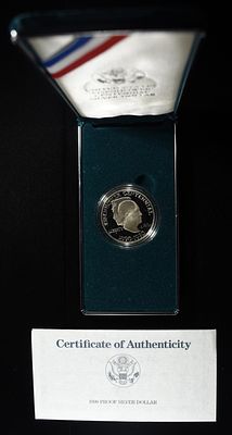1990-P $1 COMMEM EISENHOWER PROOF. WEEKLY COIN & CURRENCY AUCTIONS ESTIMATE $110 - $160.