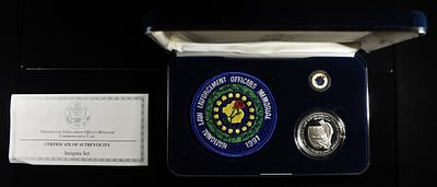 1997-P LAW ENFORCEMENT MEMORIAL INSIGNIA SET. INCLUDING PROOF MEMORIAL COMMEMORATIVE SILVER $1 