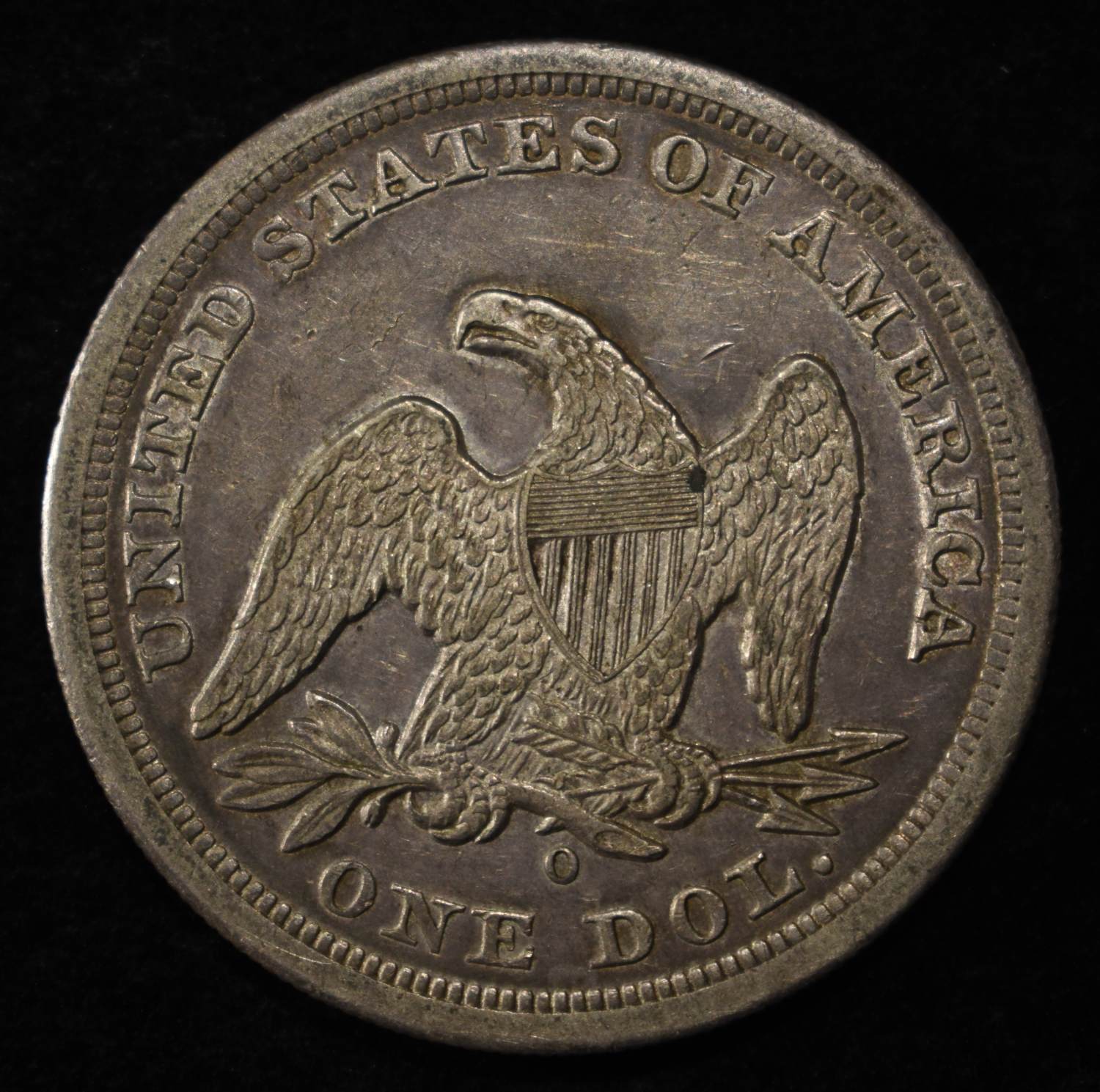 1860-O SEATED LIBERTY DOLLAR CH AU