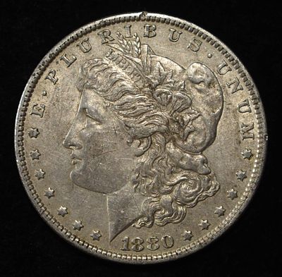 1880-O MORGAN DOLLAR XF/AU. CHECK OUT OUR UPCOMING AUCTIONS ESTIMATE $100 - $130.
