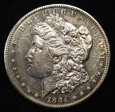 1884-S MORGAN DOLLAR CH AU. LEADERS IN ON-LINE AUCTIONS ESTIMATE $1200 - $1500.