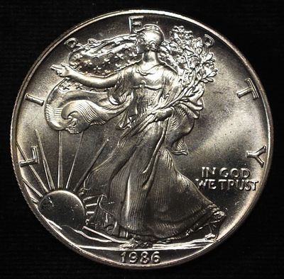 1986 AMERICAN SILVER EAGLE. WEEKLY COIN & CURRENCY AUCTIONS ESTIMATE $90 - $130.